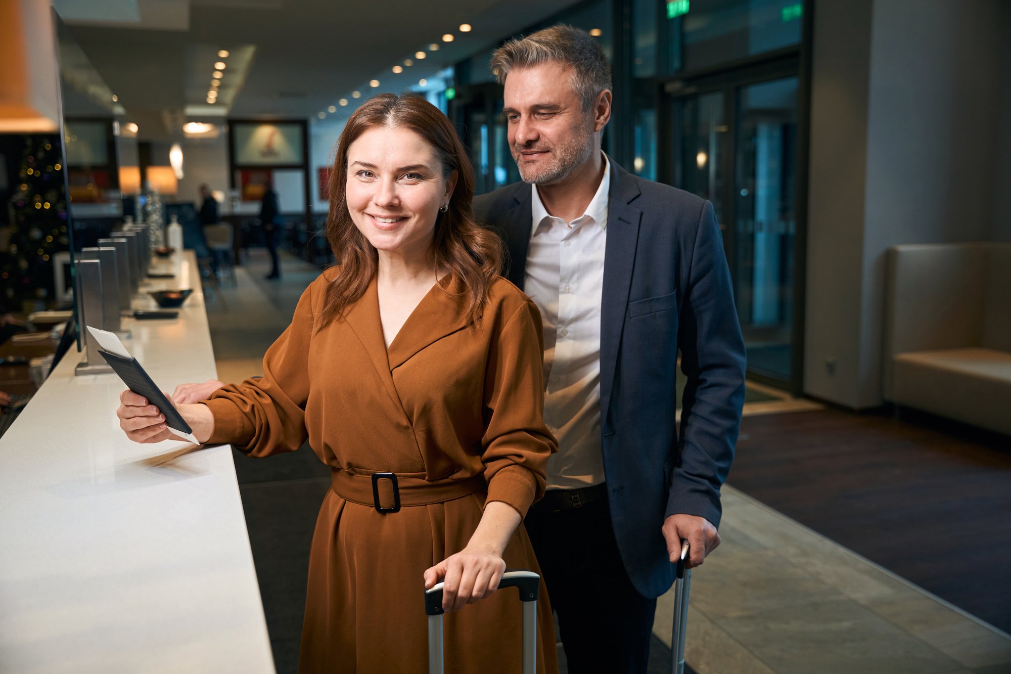 adult-caucasian-couple-standing-at-reception-desk-2024-01-22-17-48-45-utc